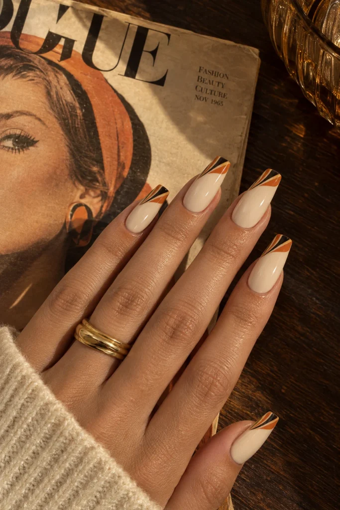 Vintage cream orange and black fan tip nails
