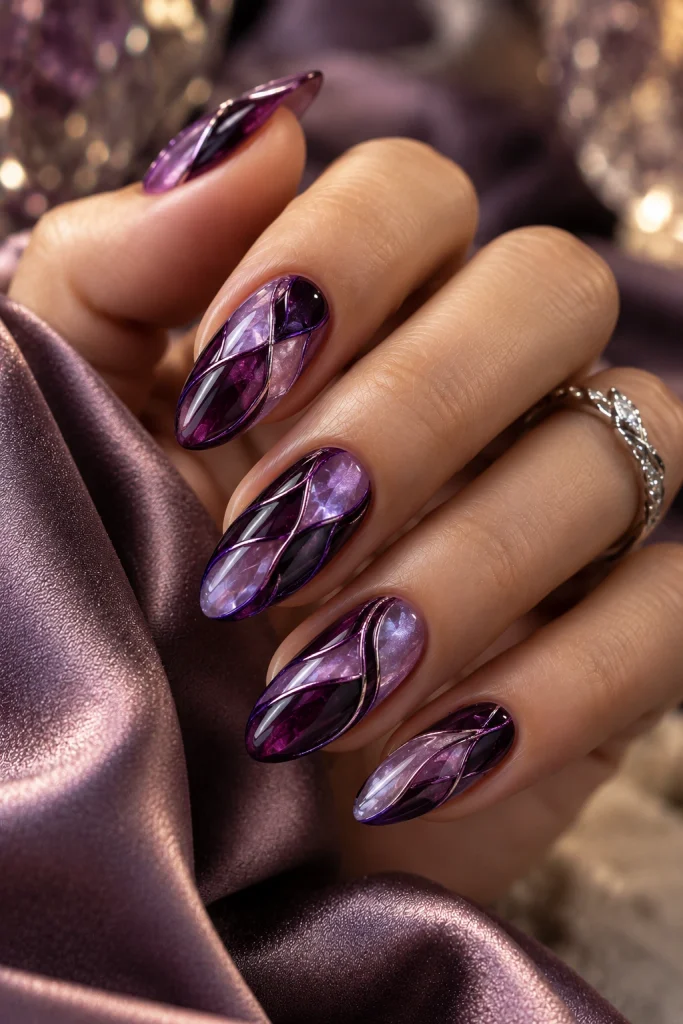Amethyst and plum stained glass nail art with translucent lavender sections and delicate silver details